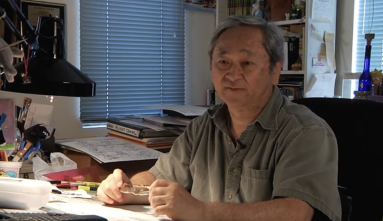Video still of Stan Sakai at his drawing desk